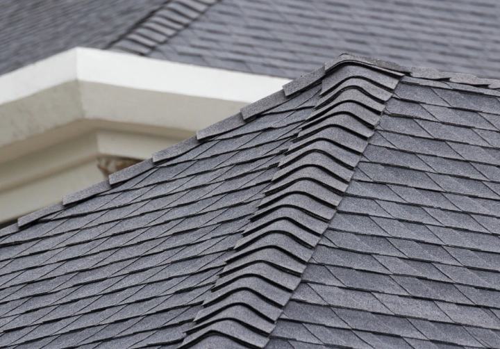 edge of roof shingles on top of the house